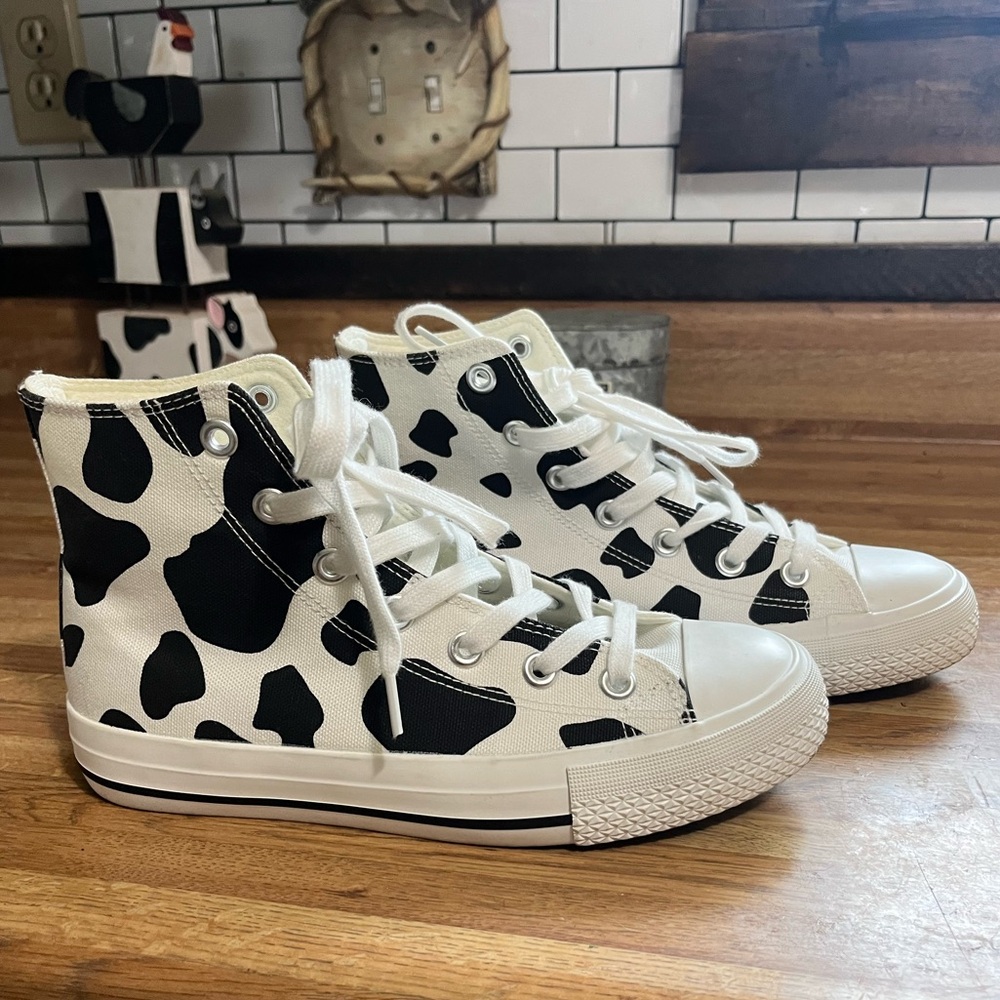Cow print high top cushionaire sneakers. Converse look alikes.